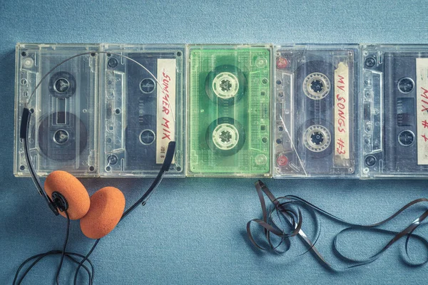 Several Old Audio Cassettes Orange Headphones Blue Sofa — Stock Photo, Image