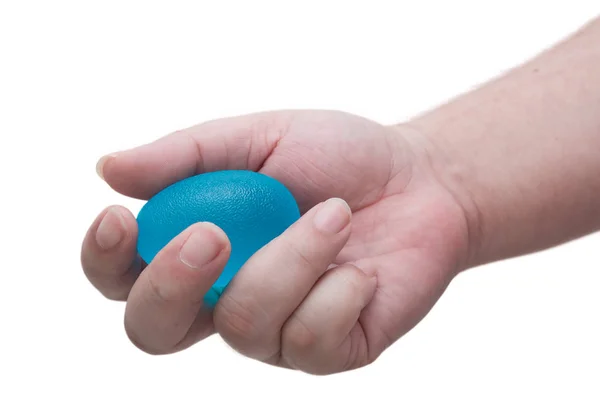 Mão Apertando Uma Bola Azul Para Exercitar Aliviar Estresse Isolado — Fotografia de Stock