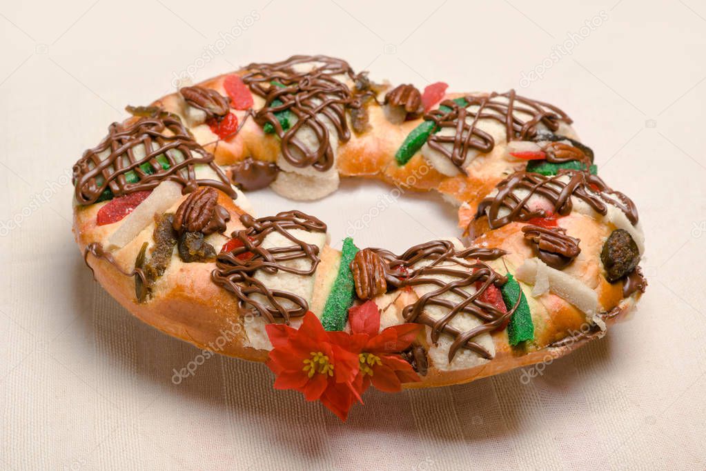 Epiphany cake, Kings cake, Roscon de reyes or Rosca de reyes stuffed and decorated with chocolate and walnut