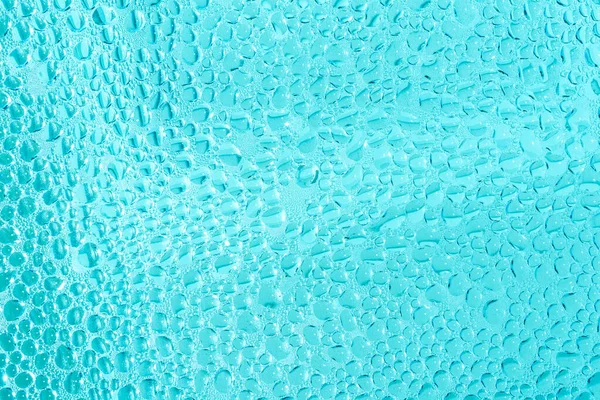 Blaues Schwimmbadwasser tropft und blubbert — Stockfoto