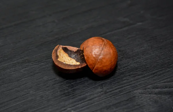 Macadamia nut on black background