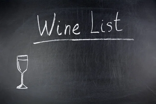 Wine list chalk text glass drawing on blackboard or chalkboard as alcohol drink menu board concept with copy space