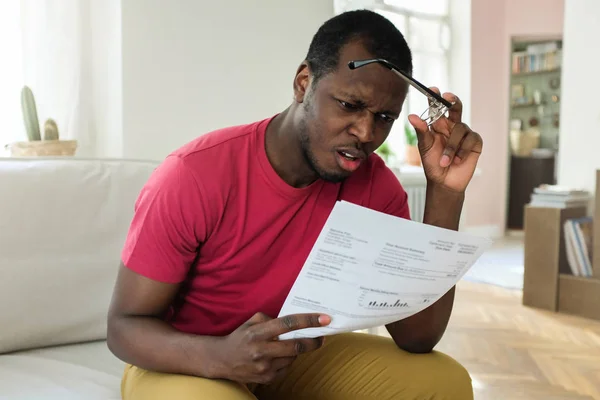 Shocked Sad African Young Man Surprised Stressed Read Utility Bill — Stock Photo, Image