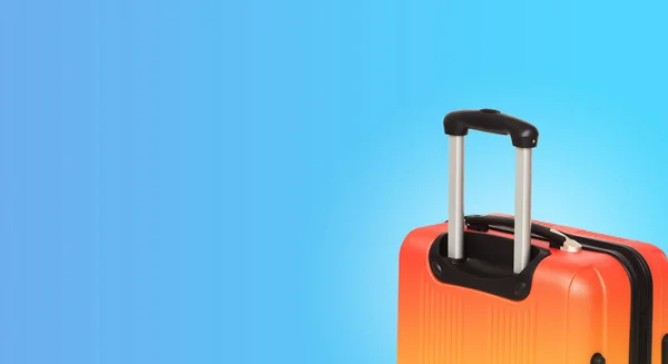 Colorful horizontal banner with suitcase and copyspace. Travelling concept.