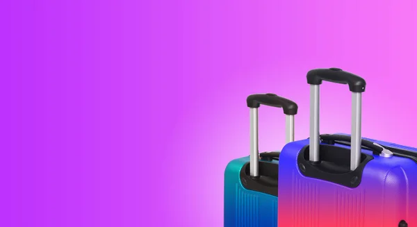 Colorful horizontal banner with two suitcases and copyspace. Travelling concept.