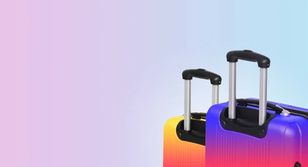 Colorful horizontal banner with two suitcases and copyspace. Travelling concept.