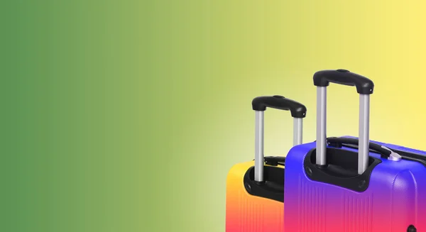 Colorful horizontal banner with two suitcases and copyspace. Travelling concept.