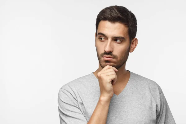 Close Portrait Young Man Looking Left Holding Chin Thinking Something — Stock Photo, Image