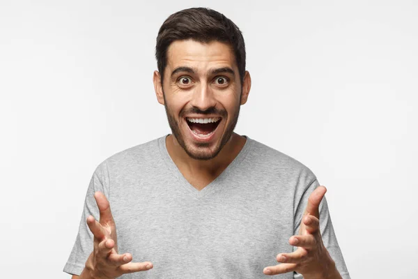 Young Man Gray Shirt Shouting Looking Camera Wide Opened Mouth — Stock Photo, Image