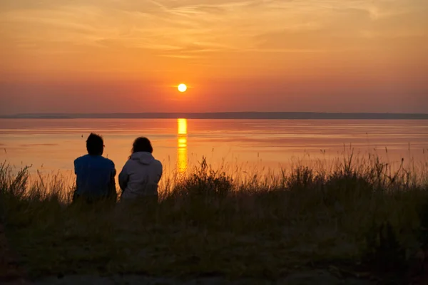 Dawn early in morning over wide long Volga river