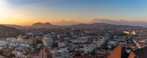 A panorama picture of the north side of Ljubljana at sunset.