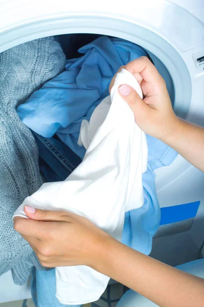 Preparing the wash cycle. Washing machine, hands and clothes — Stock Photo, Image