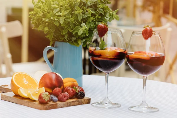 stock image summer drinks, fruit cocktails on white wood table with berries