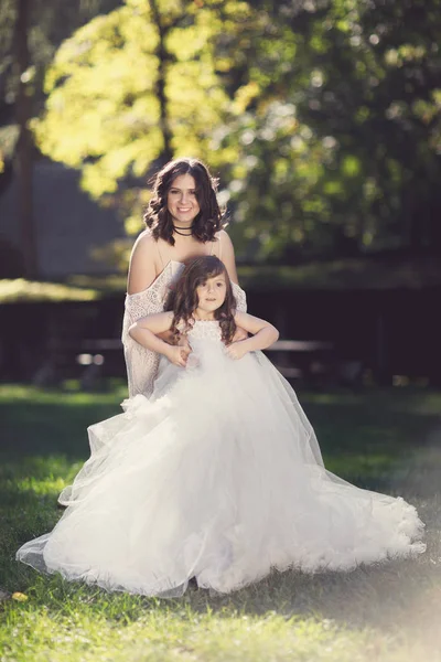 happy mother with daughter playing in park