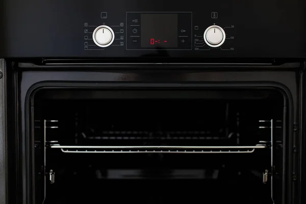 Electric oven built into kitchen furniture