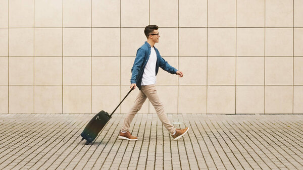 man with suitcase in the airport departure with a travel concept, summer vacation concept.