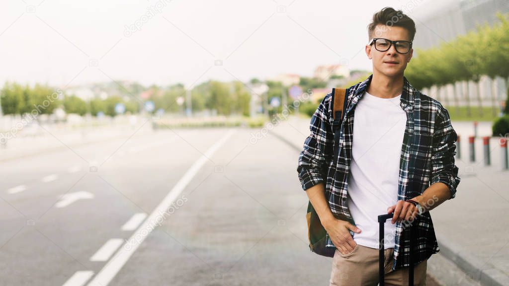 Man at the Airport with Suitcase