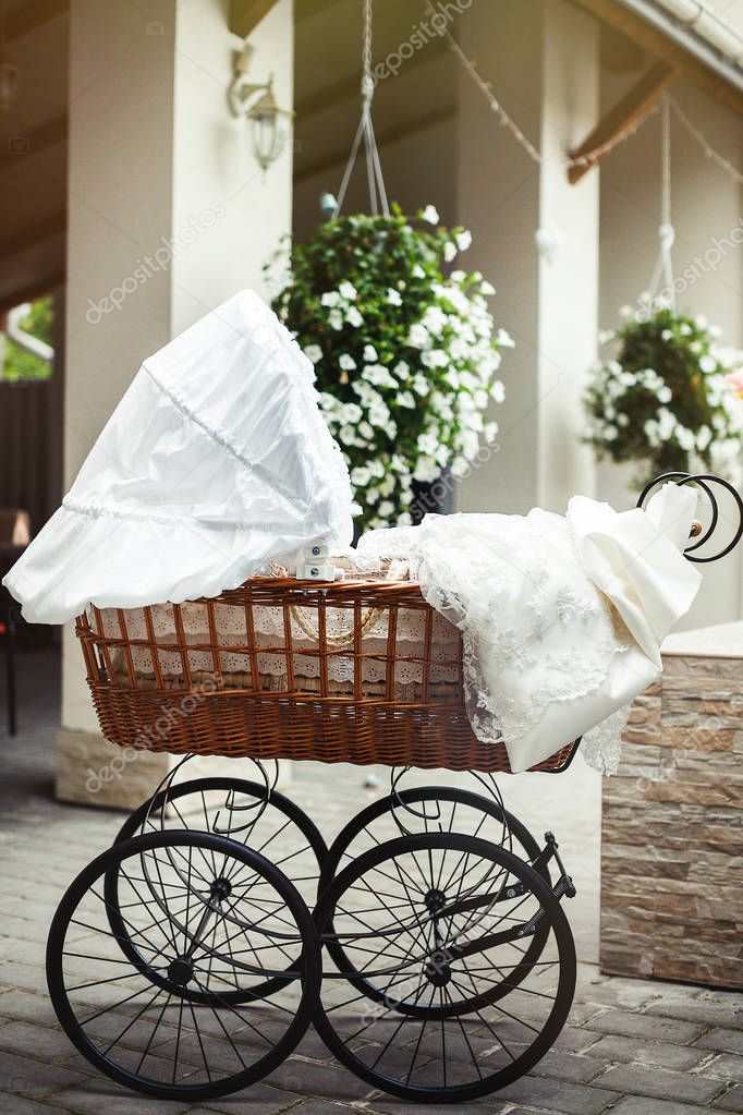 Vintage Pram Baby. Baby stroller. Vintage doll stroller in beautiful interior wiht original decoration.