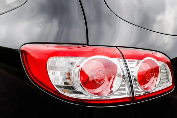 Black premium city crossover, luxury SUV rear light closeup. — Stock Photo, Image