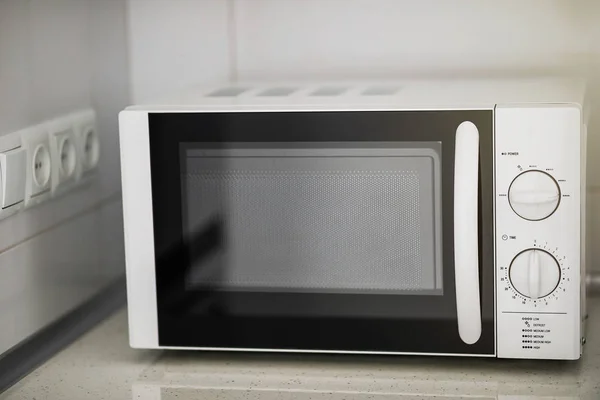 Modern kitchen interior with electric and microwave oven. — Stock Photo, Image