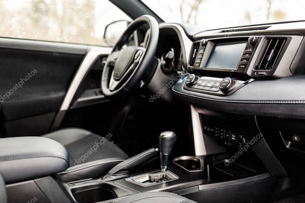 Modern electric car interior.  luxury prestige car interior, dashboard, steering wheel. Black leather interior.
