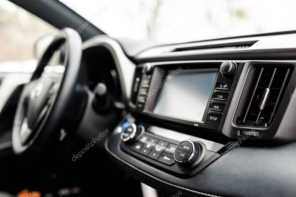 Modern electric car interior.  luxury prestige car interior, dashboard, steering wheel. Black leather interior.