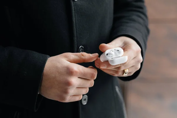 Young Man Showing Wireless Headphones Streets Man Airpods — Stock Photo, Image