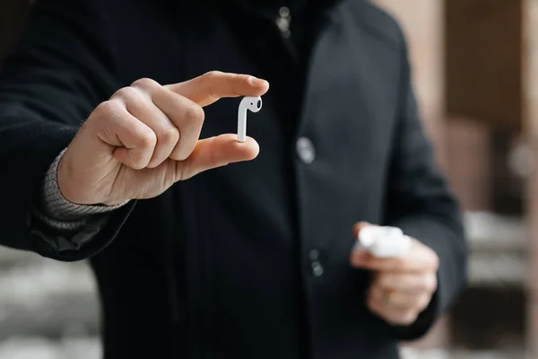 Young Man Showing Wireless Headphones Streets Man Airpods — Stock Photo, Image