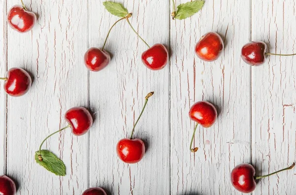 Healthy eating concept. Healthy  sweet cherries on wooden white background.