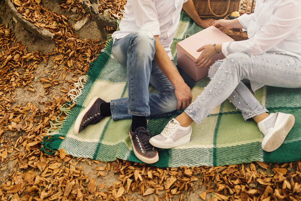 Romantic young couple walking in autumn park. Family together in the park. Pregnant couple.