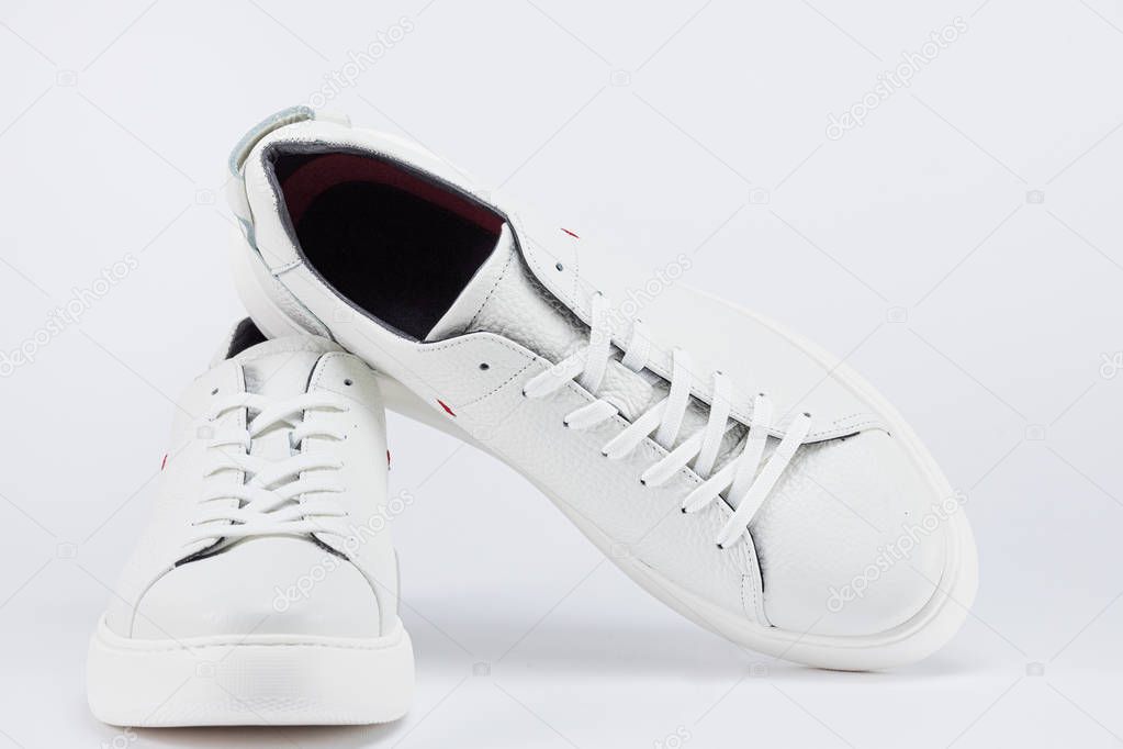 Mens shoes. White sneaker on background . 