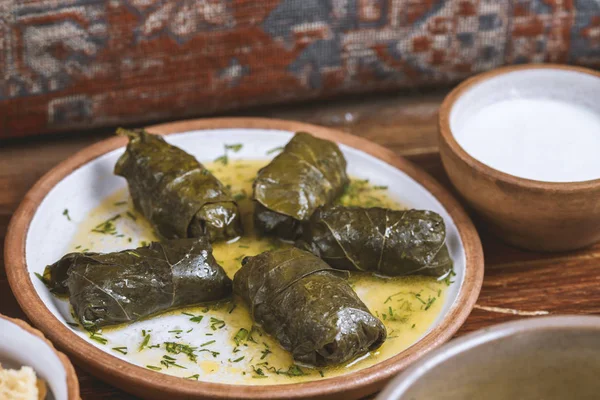 Middle-Eastern Food, Arabian cuisine, preparing stuffed vine leaves, or traditional Dolma