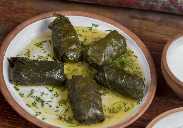 Middle-Eastern Food, Arabian cuisine, preparing stuffed vine leaves, or traditional Dolma