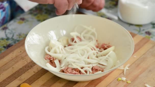 Man Cooking Tuna Noodles Salad Pouring Salt Seasoning — Wideo stockowe