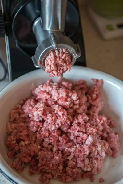 meat is ground in a meat grinder