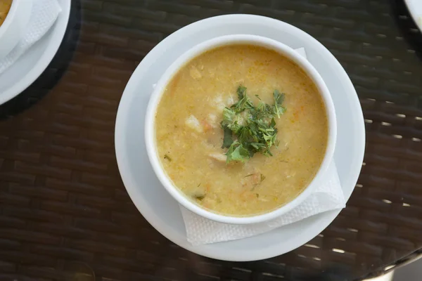 Delicious homemade soup in white plate
