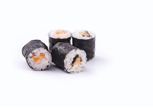 Sushi with orange filling. Sushi with salmon fish in white backg — Stock Photo, Image