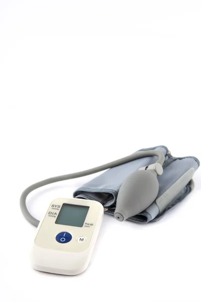 Automatic digital blood pressure monitoring meter on white backg — Stock Photo, Image