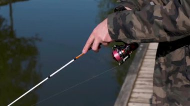 close-up footage of person fishing in river