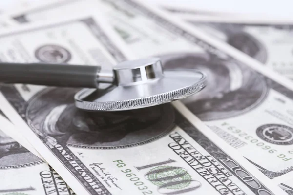 Stethoscope on money background - medical concept