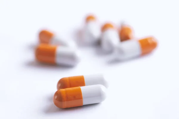 Drug prescription for treatment medication. Pharmaceutical medicament,  Pharmacy theme, Heap of orange white medicament