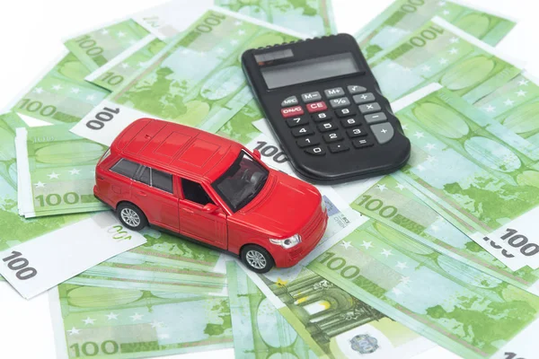 red car and money, euro and dollars. insurance concept