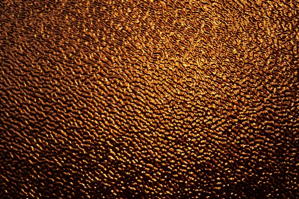 Liquid gold texture background. Golden light background