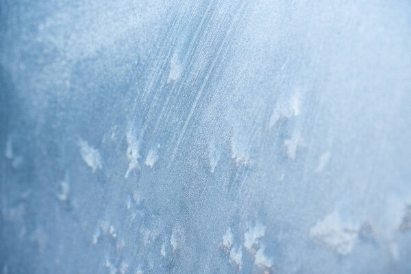 The patterns made by the frost on the window. Frosty winter background photo