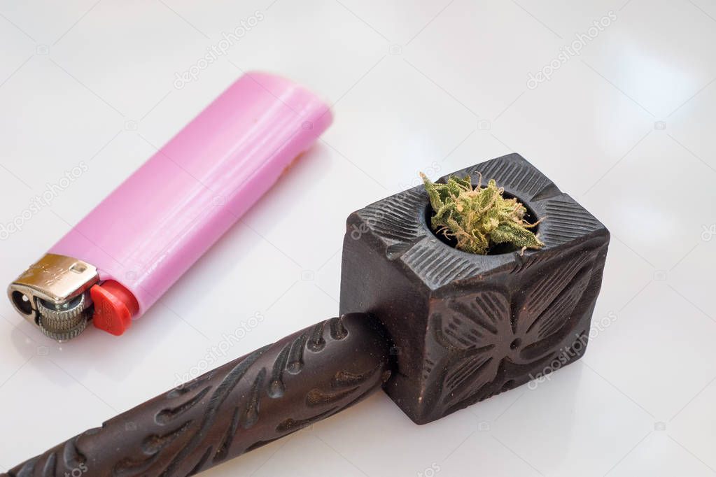 Wooden tobacco pipe and cigarette lighter on white background, hemp for smoking. smoke marijuana. Cannabis Smoking Pipe.