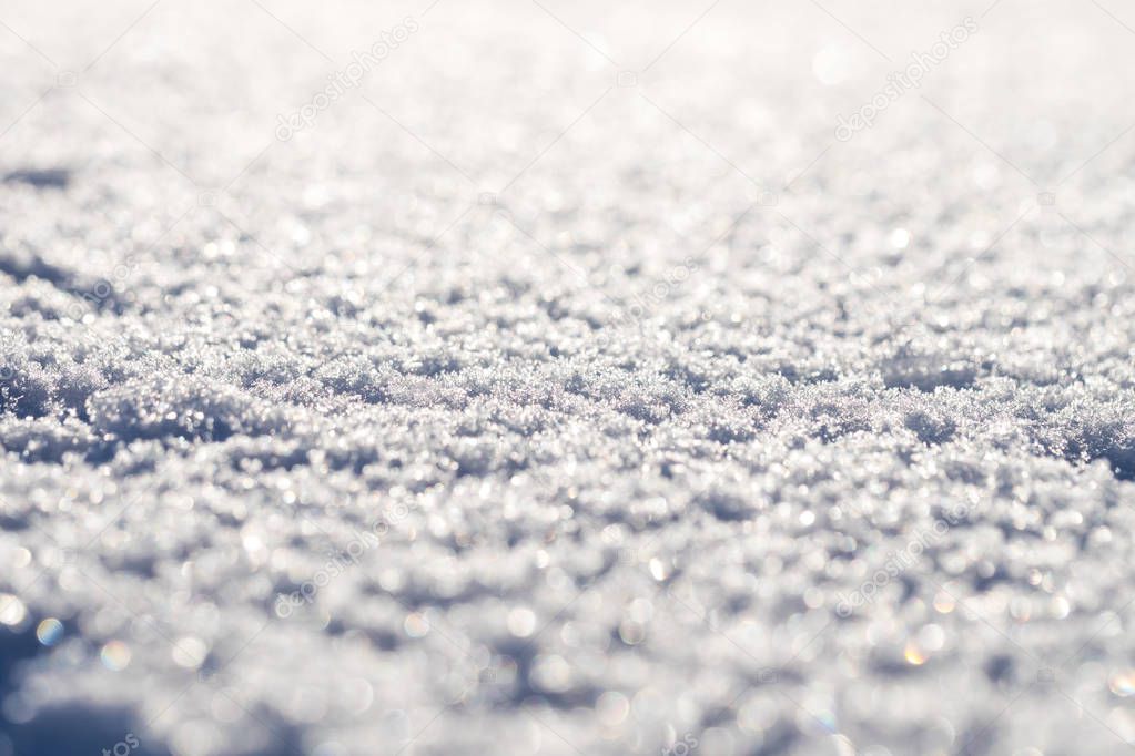 Macro shot of pure white snow with shallow depth of field and pl