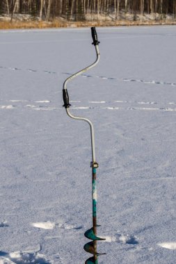 buz matkap aracı kış balıkçı. kış balıkçılık. l kış