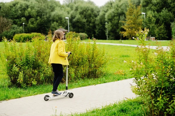 Kid girl on scooter — Stock Photo, Image