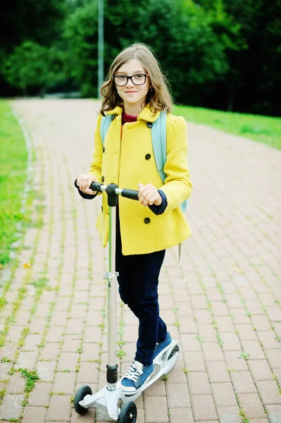 Kid girl on scooter — Stock Photo, Image