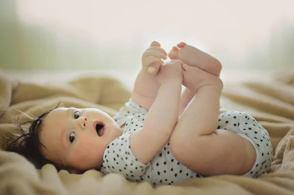 Baby boy on bed Royalty Free Stock Photos